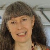 a smiling picture of Marcia Brennan